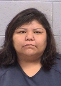 Mugshot of Leeanda Begay facing forward against a neutral background, associated with a child abuse charge in Farmington.
